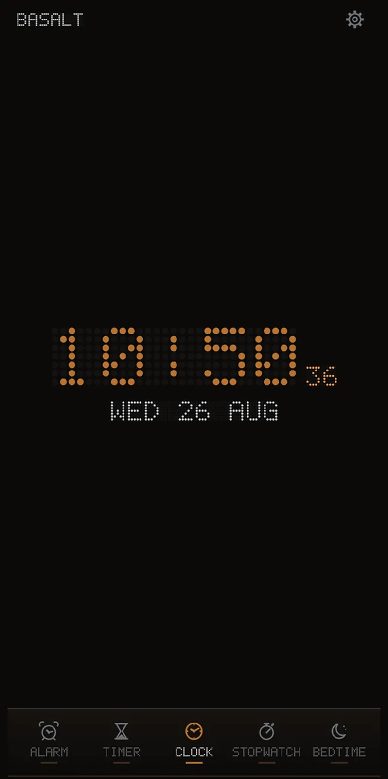 Basalt's clock readout, the time drawn in copper dots on an unlit grid