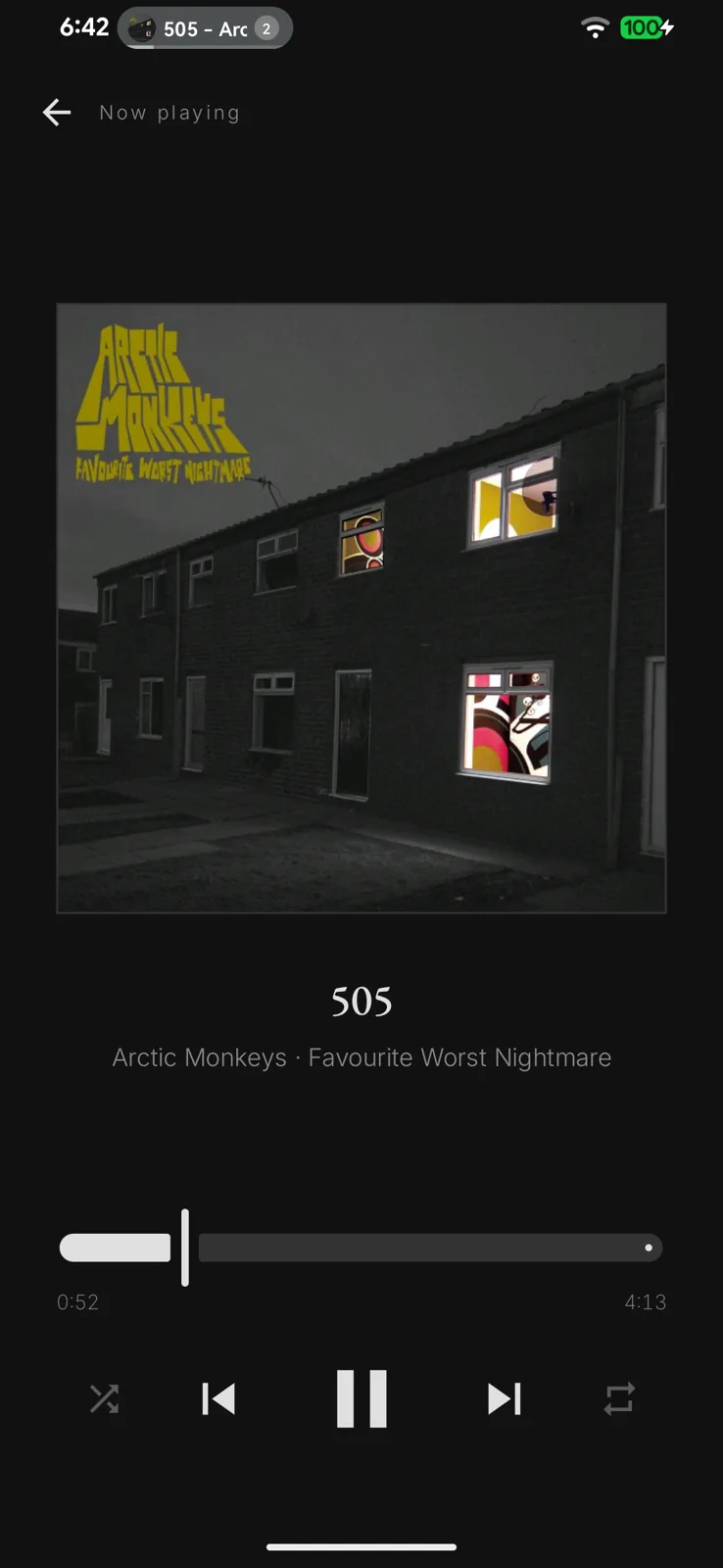The now playing screen with artwork and transport controls
